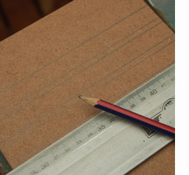 measure and mark grooves for dvd rack