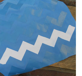 Spray paint on fabric for designer cushions