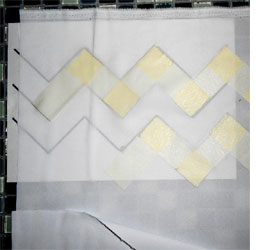 Spray paint on fabric for designer cushions