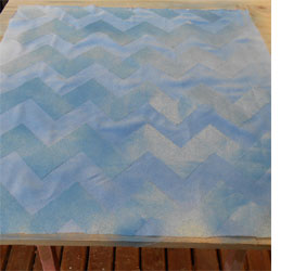 Spray paint on fabric for designer cushions