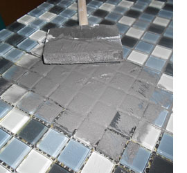 Apply mosaic tile to kitchen countertops