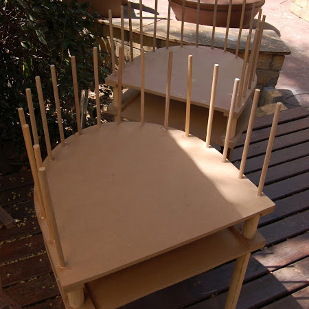 Nursery crib that becomes two chairs