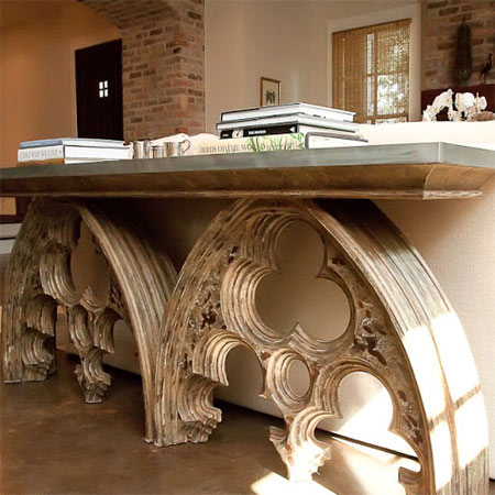 Salvaged vintage window arches are repurposed into a gilded console table