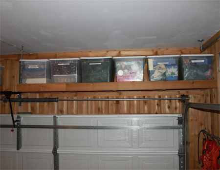 Install shelves above garage door