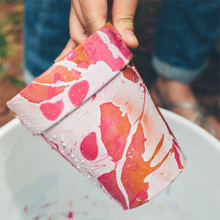 Paint pots splashed with nail varnish