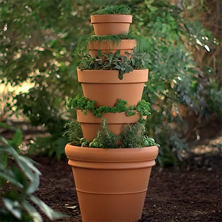 make a herb tower with plants pots for kitchen herb garden