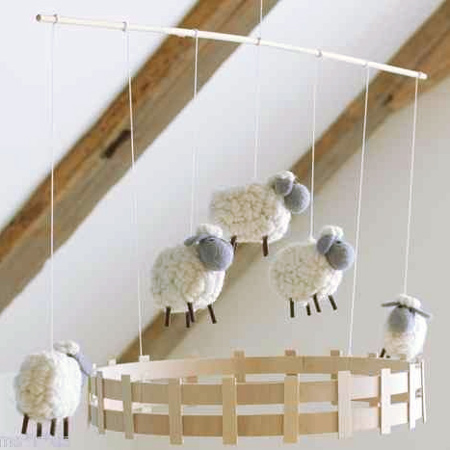 Decorate a gender-neutral nursery with a lamb or sheep theme, woolly lamp mobile
