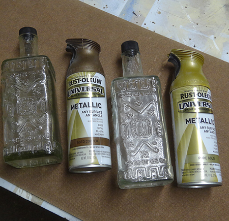 Rust-Oleum Universal titanium silver and aged copper spray paint to aged antique glass bottles