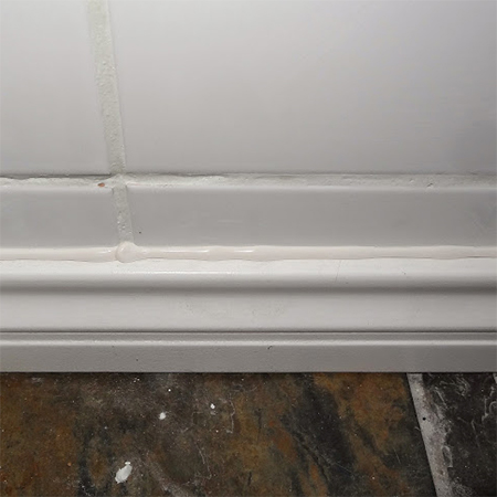 pattex air pulse sanitary silicone sealer applied along top edge of skirting