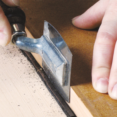 a veneer saw is fitted with a blade on two sides that allows for precision cutting, such as trimming thin veneer