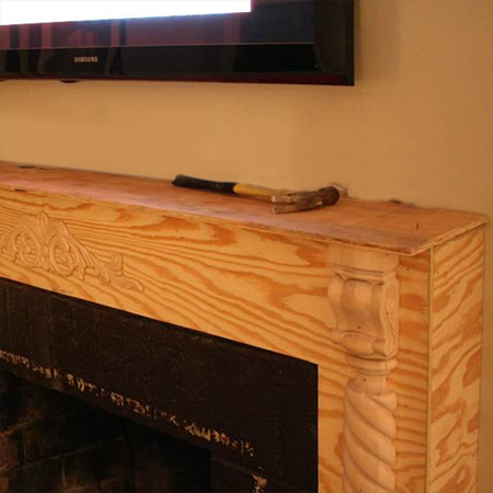 build a plywood box frame around fireplace