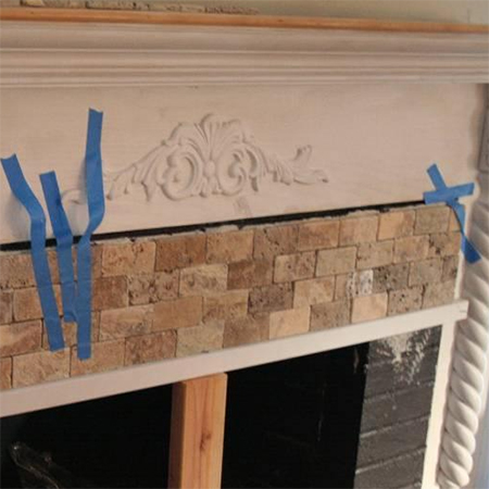 add stone mosaic tiles to fireplace front