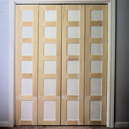 add pine or supawood moulding to built in cupboard closet doors