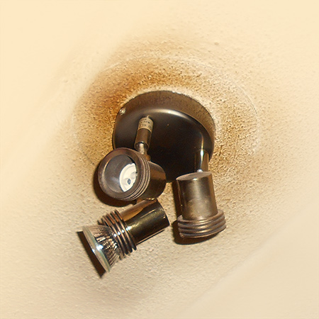 brown stains or burn marks around light fitting