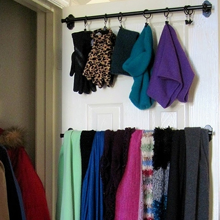 use poles and brackets on back of closet door for space saving ideas