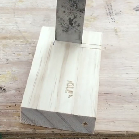 4. Use a wood chisel to chase out a slot in the block of wood. This should be approximately 5mm wide by 45mm in length.