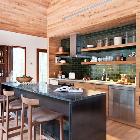Naturally modern wood homes with wood wall cladding in kitchen