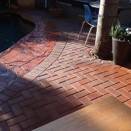 laying cement brick flooring for outdoor entertainment area