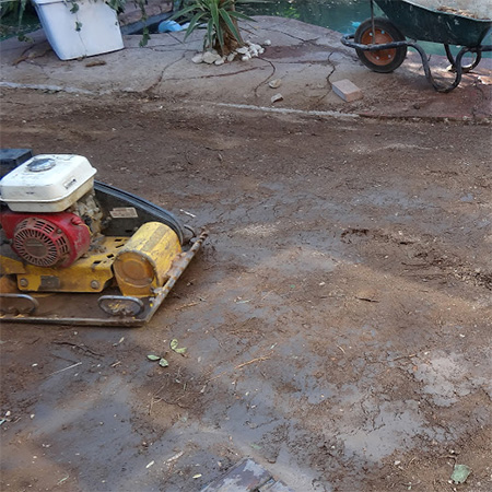 compacting ground before laying concrete paving bricks