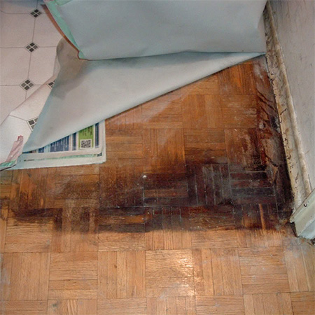 parquet floor under vinyl laminate badly stained