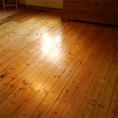 Oregon pine 
								floor after sanding and application of matt 
								floor sealer.