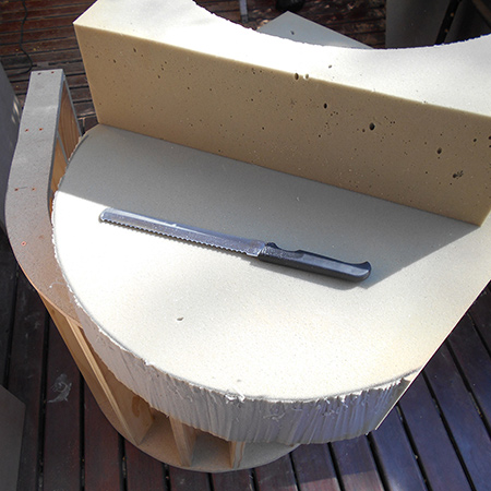Before cladding with foam the cushion was cut. I would recommend that you use the seat section to gauge the size of the foam cushion.