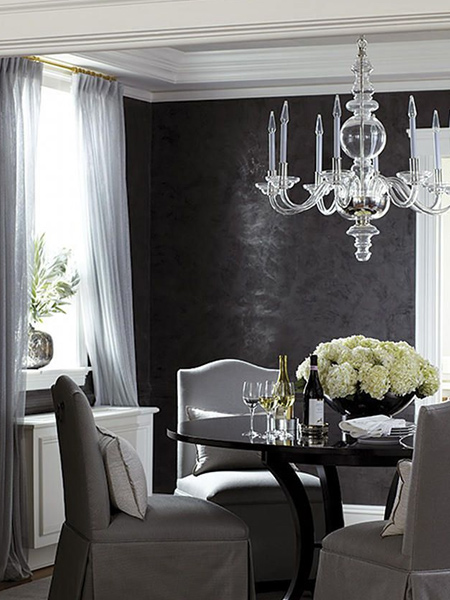 Polished black Venetian plaster is the perfect finishing touch for this formal dining room