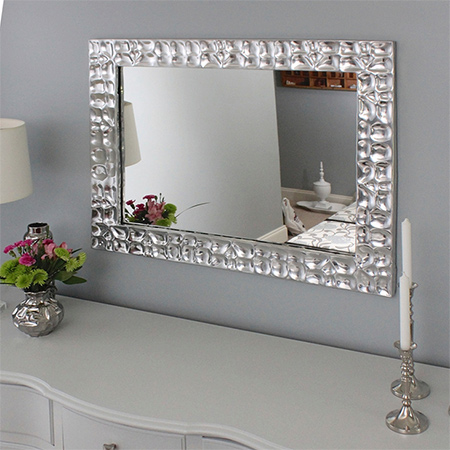 metallic framed mirror with textured design