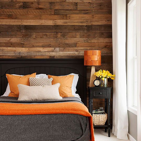 DIY reclaimed wood plank wall in a bedroom