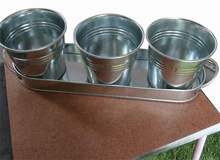 Rust-Oleum Universal Aged Copper was used on these inexpensive galvanised zinc flower pots to give them a vintage finish
