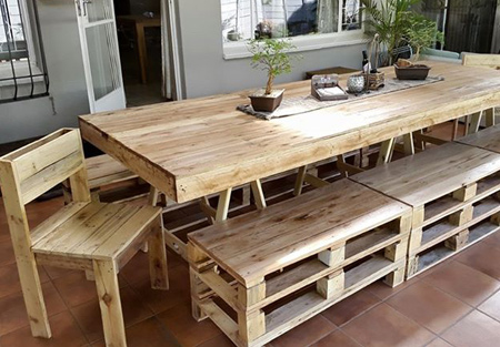Dining tables and chairs made from reclaimed pallets