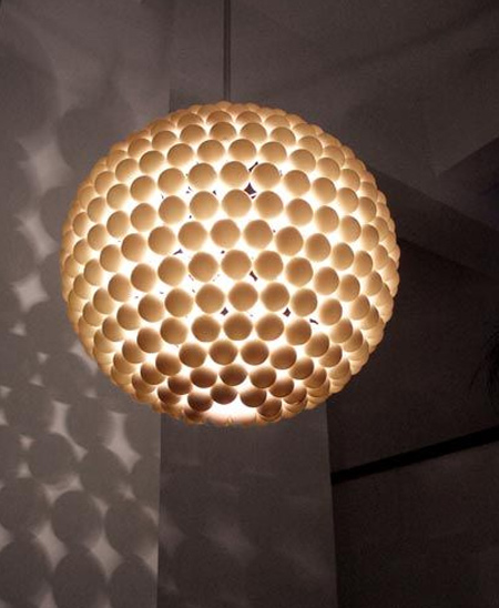 You can use any shape of lampshade or frame to make your own contemporary lighting with ping pong balls