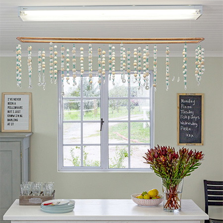 Here's how to turn an ordinary fluorescent lighting fitting into an eye-catching feature using affordable materials.