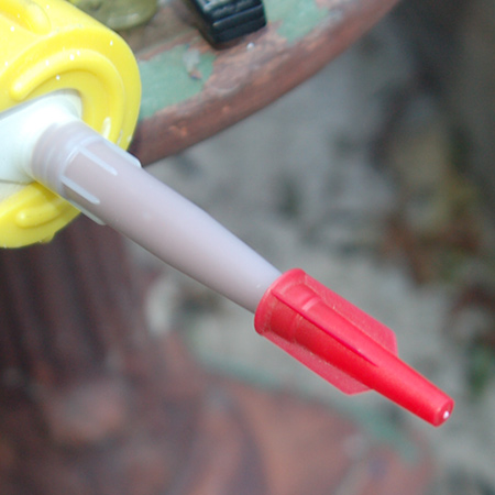 Pop the cartridge into a caulking gun and slowly squeeze the gun to release a bead of Wood Mate along the edge of the frame. If you need to stop at any time, start where you left off.