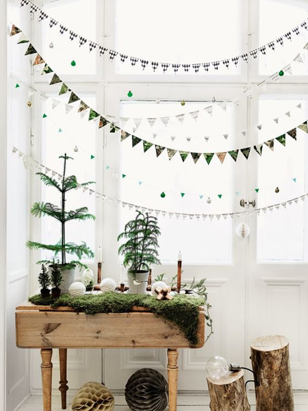 Organic materials used for decorating a home for the holiday season include wood, paper, and native Christmas trees and greenery picked fresh from the garden.