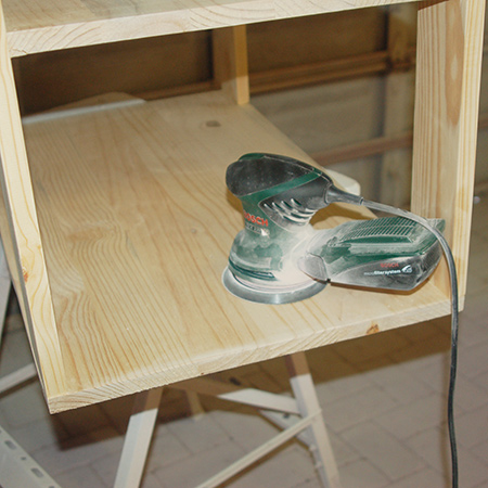 Mobile kitchen island being sanded