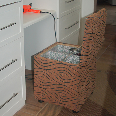 upholstered storage ottoman for hair drying tools and accessories