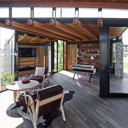 timber wood home has timber roof beams and wood floor