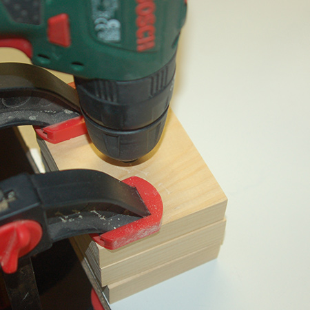 Secure the plug cutter in the end of your drill / driver and, on full power, mark the top of the wood for the plugs to a depth of about 5mm. Note: If your template block is thinner than ours you might be able to cut out the entire plug.