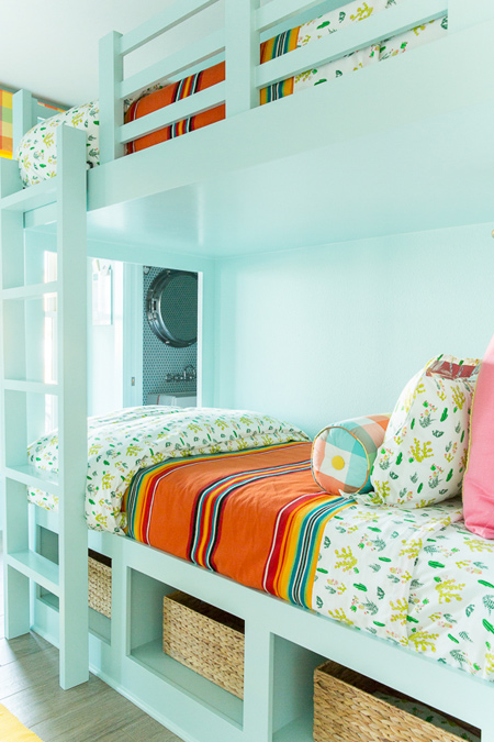 When designing your bunk beds make sure to allow for storage space in the base. This can be something as simple as open compartments for baskets for storage bins, or properly fitted pullout drawers, or simply compartments with doors to keep clutter out of sight. 