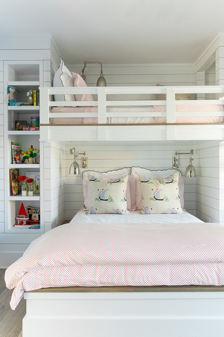 The queen bed can accommodate two girls, while the bunk above is ideal for a young boy. Or the larger bed can be for adults and a child can sleep on the top bunk. This is a great idea for a smaller home, or a guest cottage with limited space. 