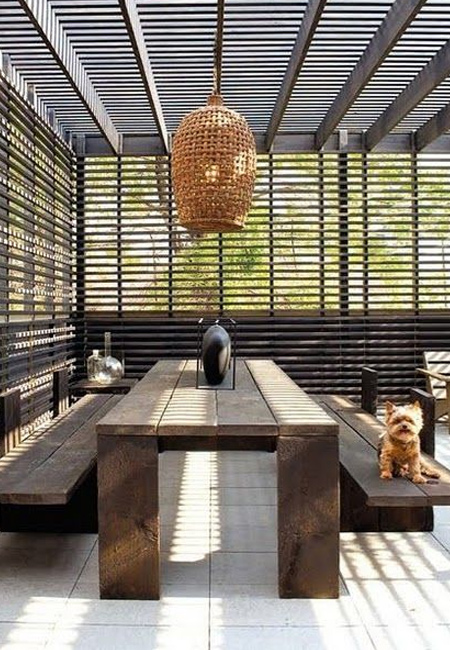 If space allows, a large shade umbrella can be incorporated into the design. Or you can look at building a simple pergola with slatted roof that provides a small amount of shade.