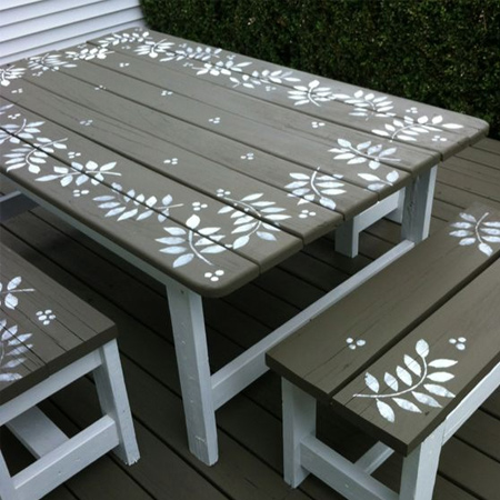 For a rustic finish to your stencilled table, lightly sand back the painted design