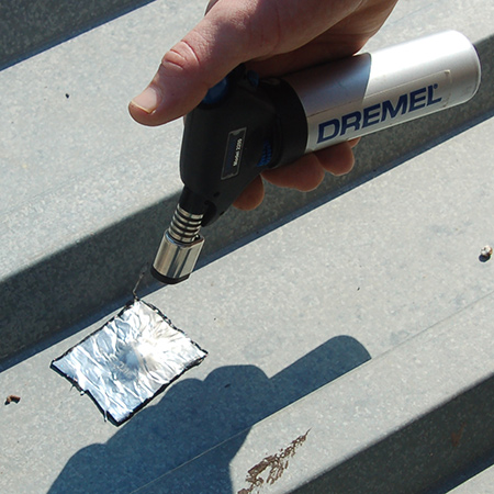 Apply heat over the surface to bond the bitumen tape to the roof. This quick fix will prevent any drips and leaks via damaged roofing screws in IBR roofs.