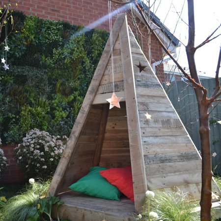 Practical for outdoor use once sanded smooth, reclaimed wood pallets are transformed into a wonderful outdoor tee pee play area for children