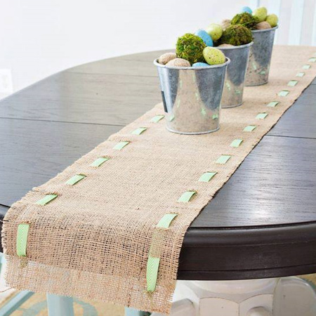 Cut a length of burlap for your dining table and trim to allow for colourful ribbon to be threaded through the fabric. 