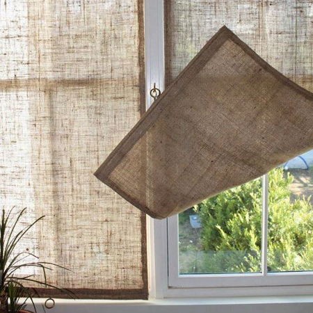 Block out the sun without blocking out too much light with burlap window panels. The coarse weave of burlap offers you privacy and shade.