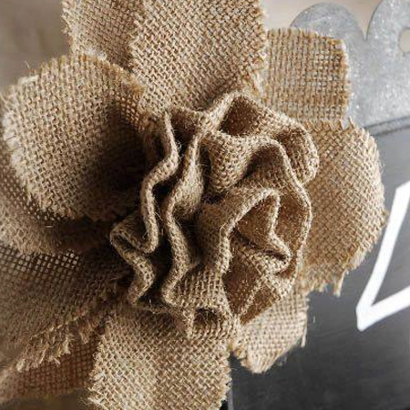 Use burlap scraps to make shabby roses for your cushions.