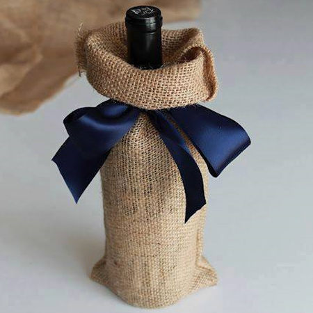 Just in time for the festive season... use burlap to wrap gifts that have an awkward shape such as wine bottles. Finish off with a satin ribbon