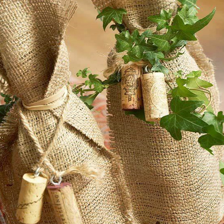 Just in time for the festive season... use burlap to wrap gifts that have an awkward shape such as wine bottles. Decorate with wine corks
